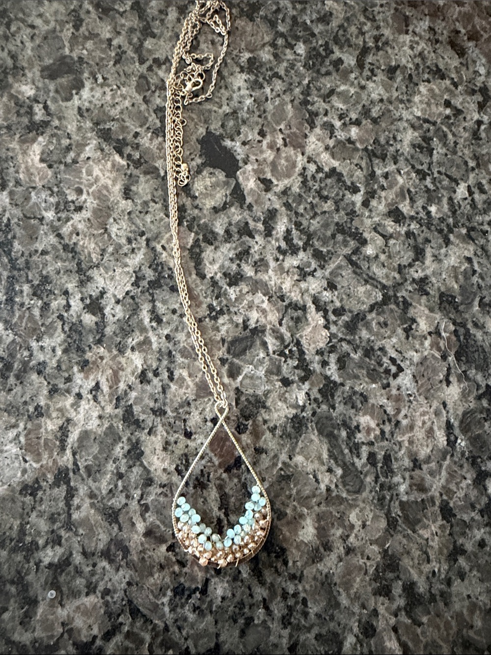 Delicate Gold Teardrop Necklace with Light Blue Stones